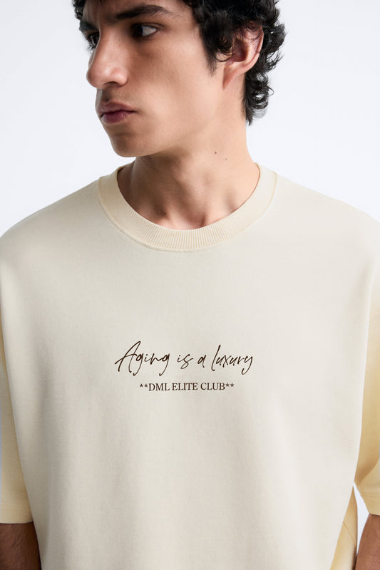 IVORY - AGING IS A LUXURY FRENCH TERRY OVERSIZED T-SHIRT