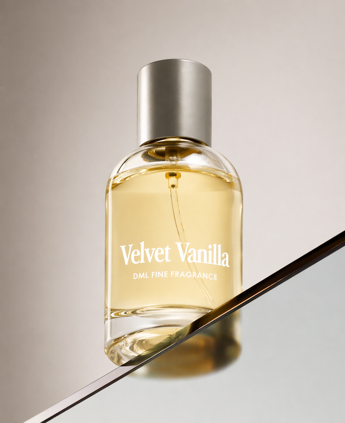 Perfume bottle labeled 'Velvet Vanilla' on a reflective surface with a neutral background