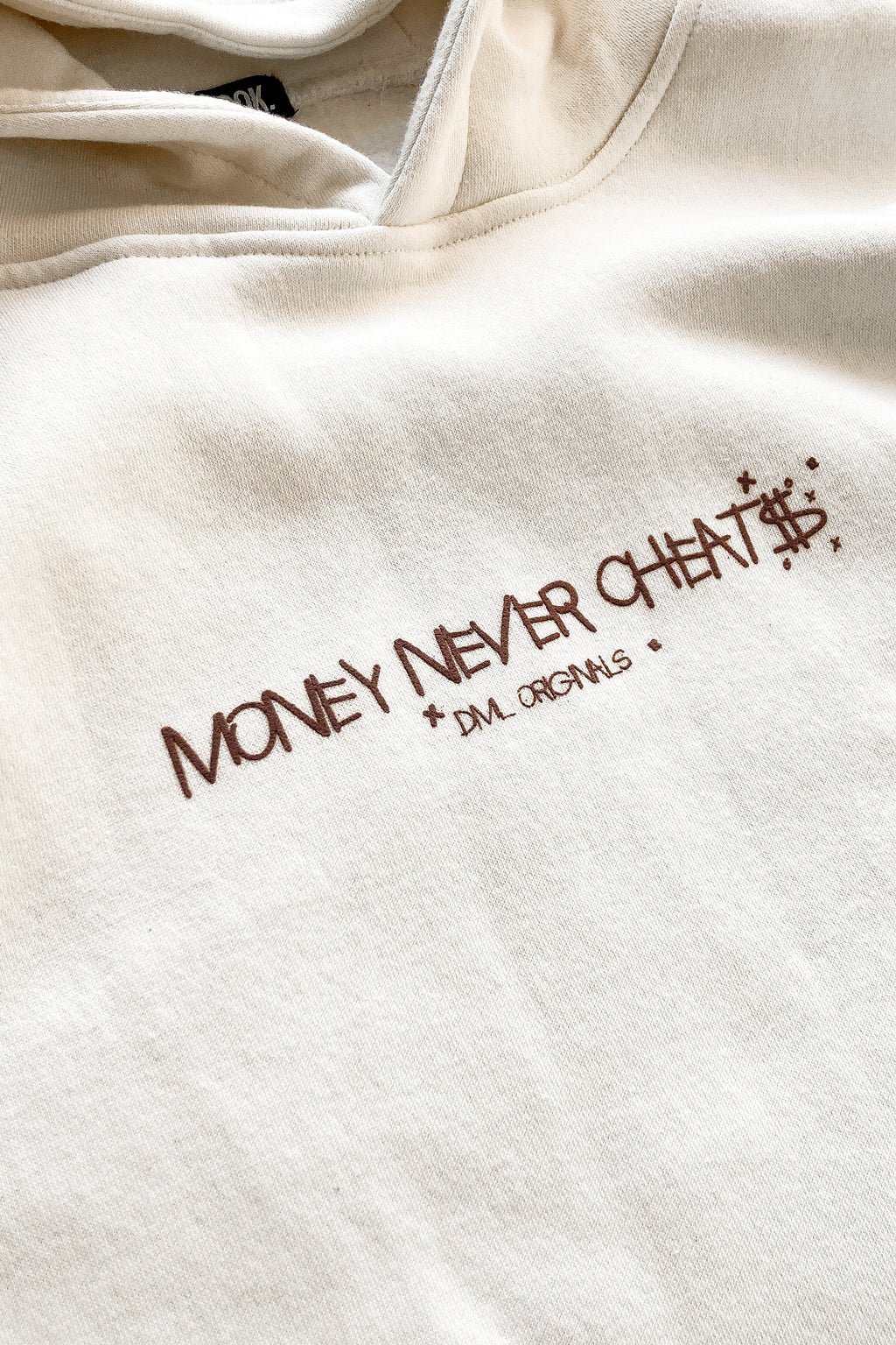 MONEY NEVER CHEATS OVERSIZED FIT HOODIE - OFF WHITE