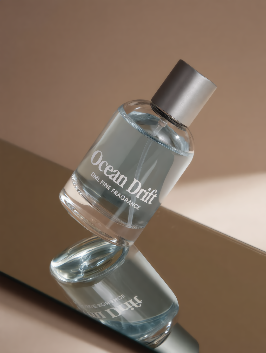Ocean Drift perfume bottle on a reflective surface with a neutral background